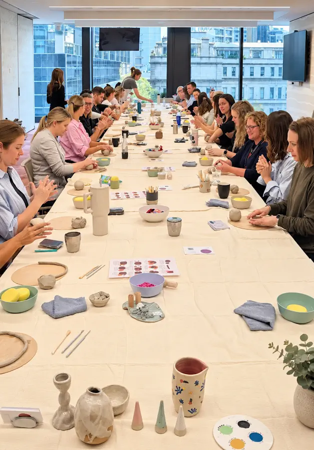 Corporate pottery workshop with a large team at a Melbourne workplace