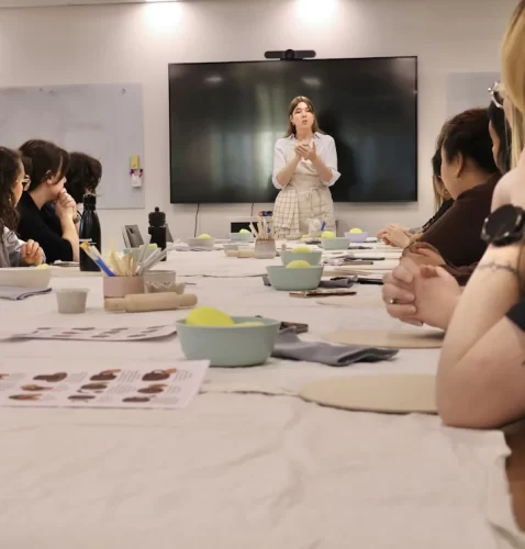 Emma teaching pottery to a corporate team in Melbourne CBD