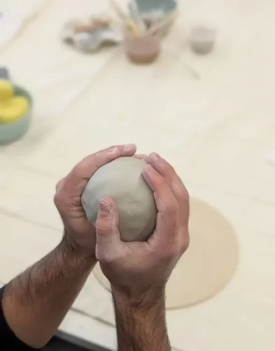 Participant creating pottery at a corporate pottery workshop in Melbourne